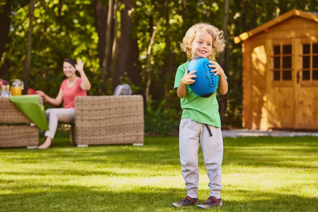 Boy holding rugby ball Boy holding rugby ball